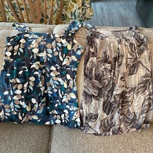Like new set of two size SP sleeveless namebrand shirts. And Taylor and NYC.